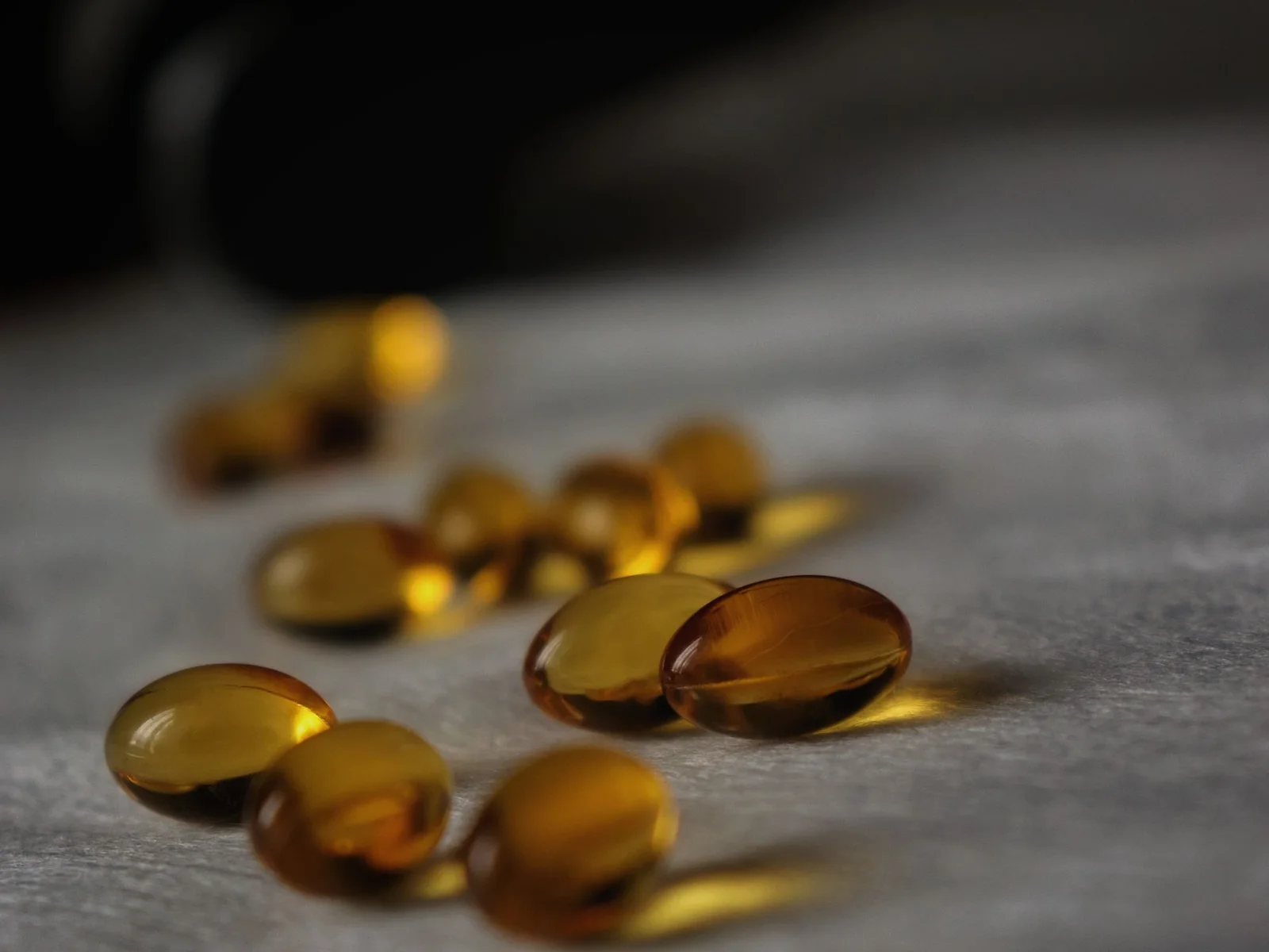 Golden oil-based softgel capsules